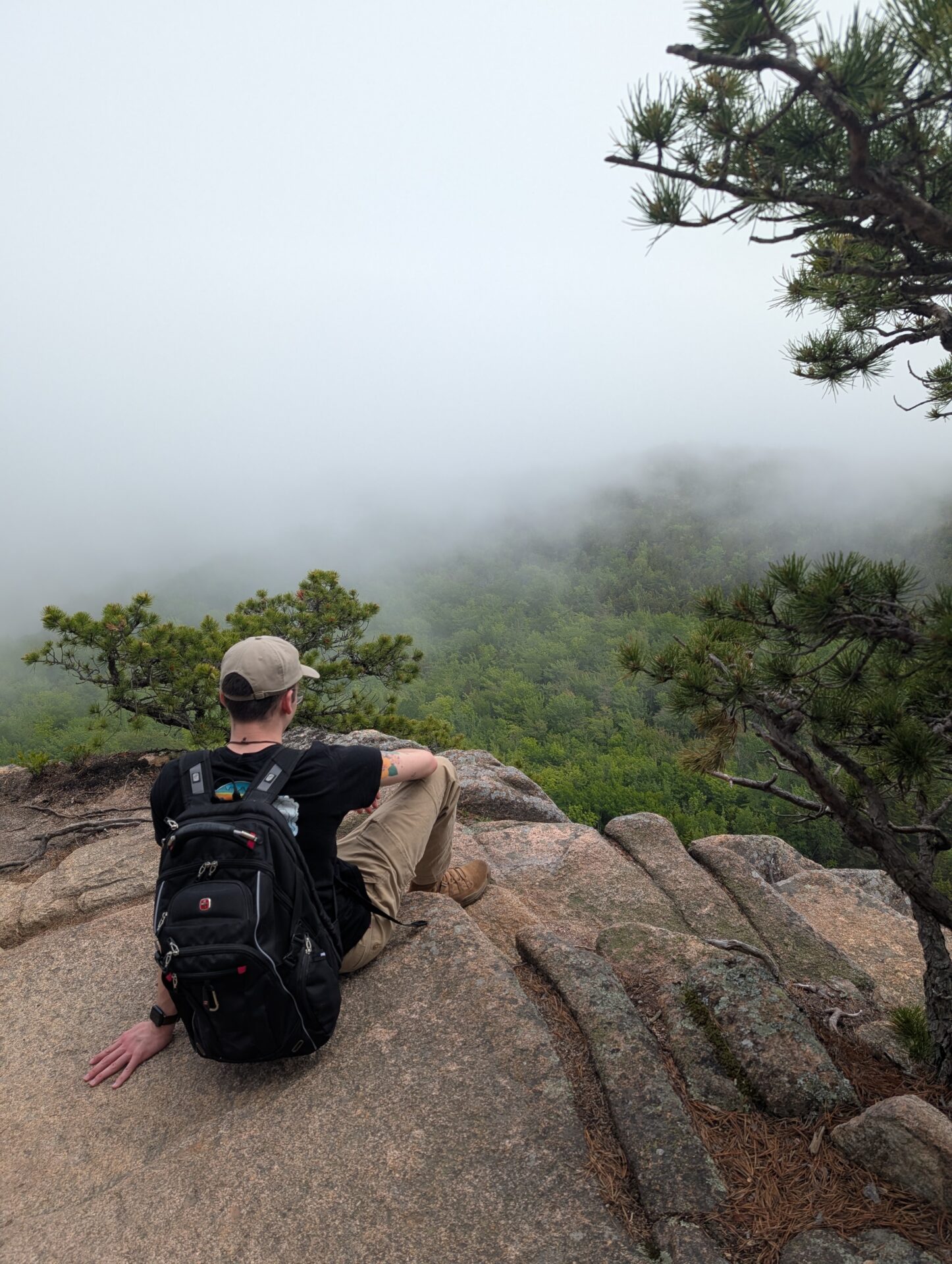 Photo of Harrison sitting over the ledge