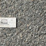 business card dropped on concrete