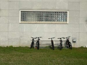 student bikes up against a dorm hall exterior